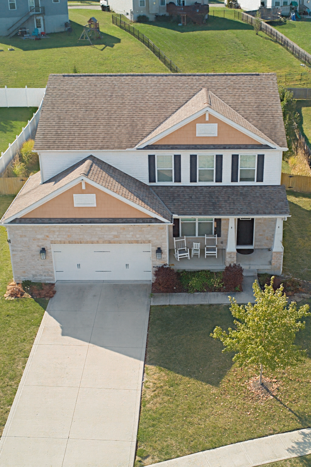 Drone aerial overview showing home, neighborhood, and surrounding landscape.